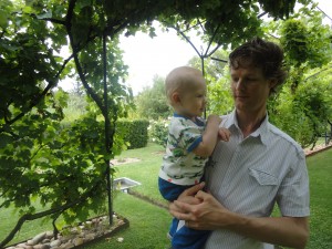 Oskar signs grape during a visit to a vineyard