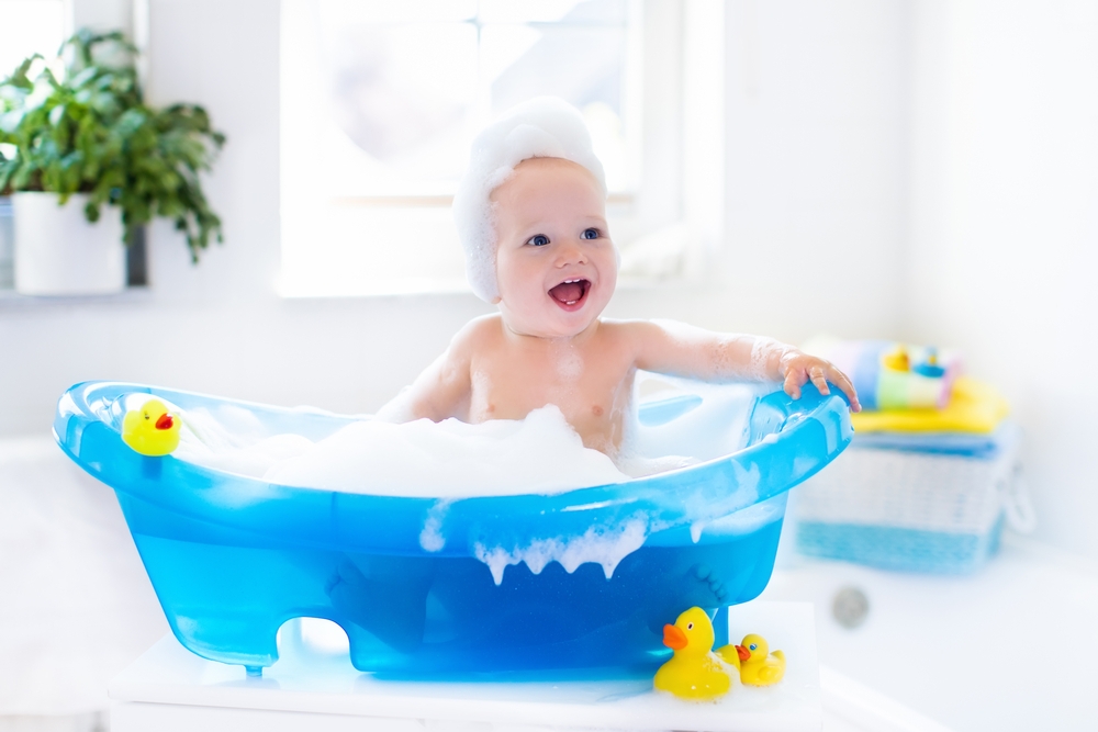 Baby takes a bath and learns how to sign